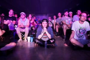 Landon, a 17-year-old transgender teen, watches as Dave Bazan performs.