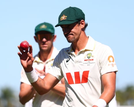 Mitchell Starc walks off the field after taking five wickets before lunch on day one of the second Test