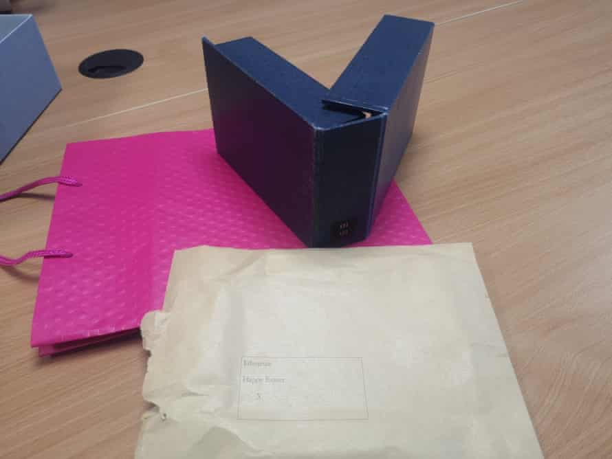 Pink gift bag and typed envelope.