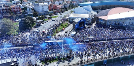 Fans cheer Deportivo’s players on their celebratory bus tour.