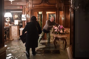 Employees of the Gritti Palace protect furniture