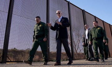 Joe Biden walks along the border fence