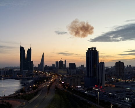 Smoke rises above the Manama skyline after an Iranian drone was intercepted on Friday