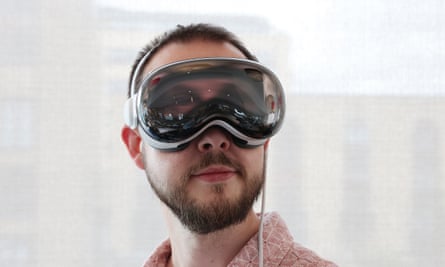 The Vision Pro headset showing the eyes of the wearer on its outside screen.