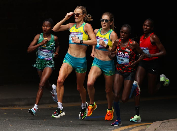(L - R) Failuna Matanga of Tanzania, Eloise Wellings of Australia, Jessica Stenson of Australia, Margaret Wangari Muriuki of Kenya and Helalia Johannes of Namibiapound the roads.