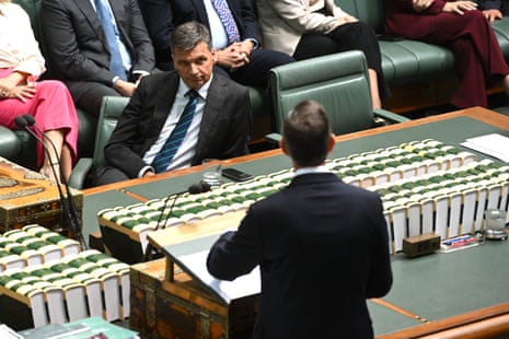 Angus Taylor listens to Australian treasurer Jim Chalmers