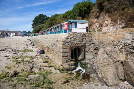 A pipe at Swanpool beach … some storm overflow pipes containing a mixture of sewage, rain and surface water were discharged into the sea this summer.