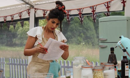 Ruby consults her checklist in The Great British Bake Off.