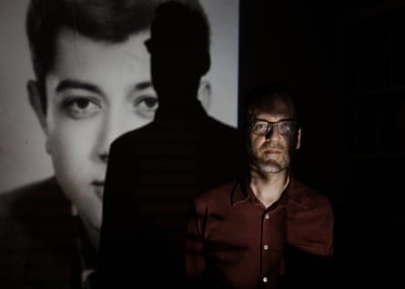 Writer David Batty in front of an image of his birth father, Monti