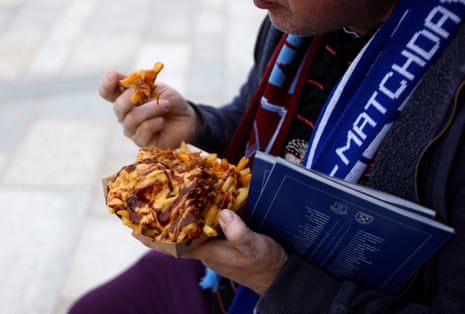 A fan eats some food