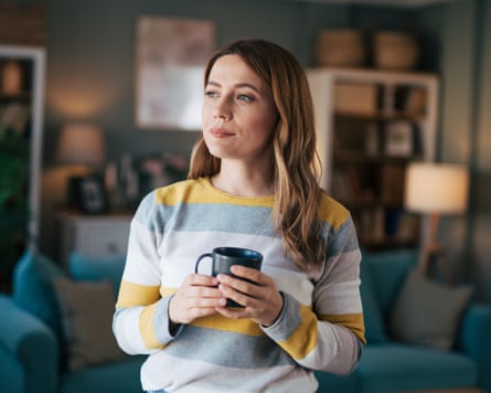 Woman drinking hot drink from mug