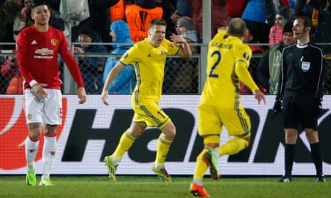 Rostov’s Aleksandr Bukharov celebrates scoring against Manchester United, to the frustration of Marcos Rojo