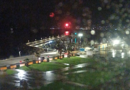 A photo taken by a local fisher shows an emergency rocket being launched from the Bayesian