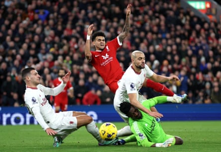 17 December 2023Luis Díaz of Liverpool has a shot blocked by Sofyan Amrabat and André Onana of Manchester United as Diogo Dalot also closes in to help during the 0-0 draw at Anfield.