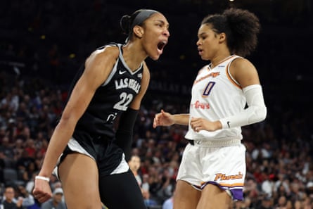 A’ja Wilson of the Las Vegas Aces, left, celebrates in front of Satou Sabally of the Phoenix Mercury after making a basket during Game 2 of the WNBA finals.