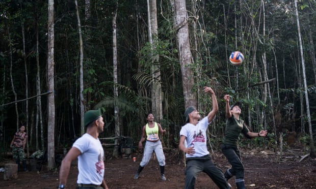 Playing volleyball in highly visible white T-shirts would have been unthinkable before the cessation. Photograph: Stephen Ferry for the Guardian