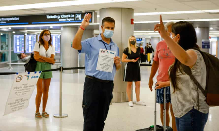 Travellers are informed about free Johnson & Johnson vaccines at the Miami international airport, Florida.