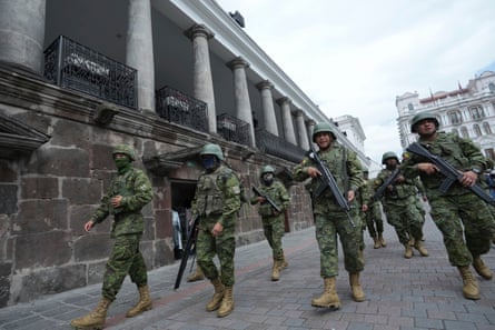 Soldiers patrol outside the government palace during a state of emergency in Quito, Ecuador on 9 January 2024.