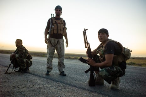 Members of the Asa’ib Ahl Aal-Haq, on the frontlines with Isis, in Diala province to the east of Baghdad, in July 2014. Assaib Ahl al-Haq is one of the ‘loyalist factions’ of the Hashed, with allegiances to the Iranian military and religious leadership.