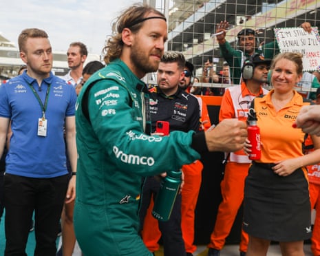 Sebastian Vettel is greeted during the drivers’ parade at Abu Dhabi on Sunday as fans hold a ‘danke Seb’ sign in the background.