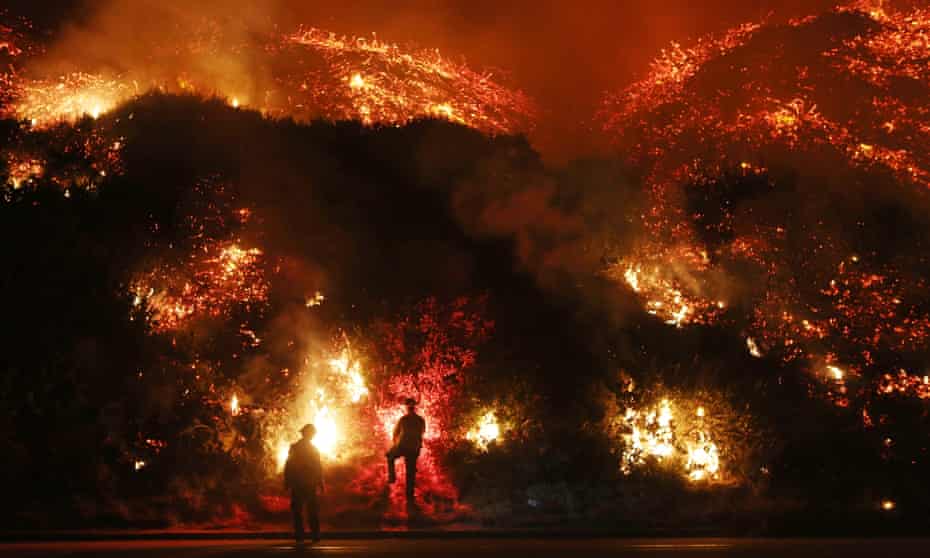 Welcome to Christmas in California.  Firefighters monitor a section of the Thomas Fire along the 101 freeway on December 7, 2017 north of Ventura, California. Strong Santa Ana winds are rapidly pushing multiple wildfires across the region, expanding across tens of thousands of acres and destroying hundreds of homes and structures.