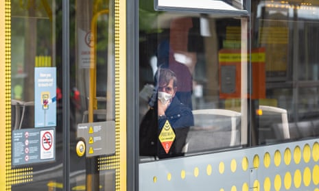 A passenger wearing a mask on a tram in Manchester.