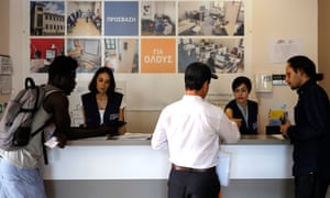 NGO workers dealing with refugees at the Athens Solidarity Centre. Many hope to travel from Greece to reunify with family in the UK.