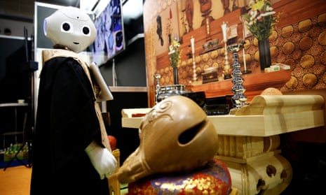 A ‘robot priest’ wearing a Buddhist robe stands in front of a funeral altar during its demonstration at Life Ending Industry Expo 2017 in Tokyo, Japan.