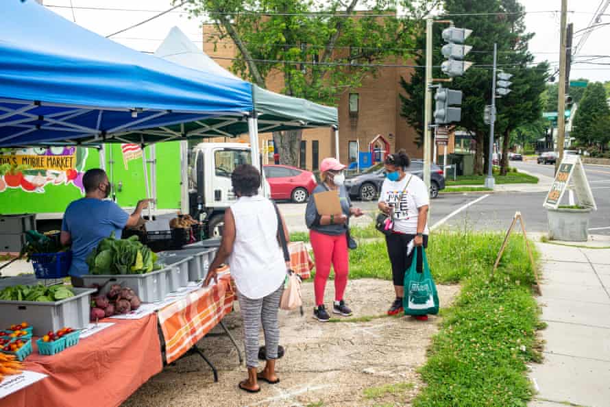 People shop at the Arcadia Mobile Market in the Fort Dupont neighborhood in Washington DC.