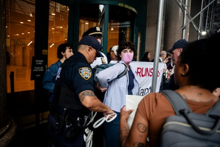 Protestors are arrested outside of Palantir’s New York office.