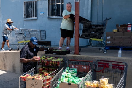 Volunteers organize groceries at a food pantry