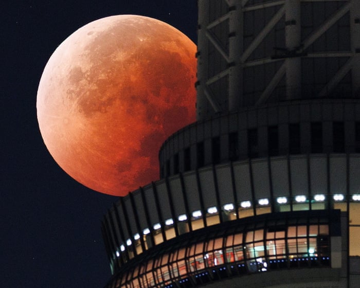 Blood moon and lunar eclipse shines around the world – video