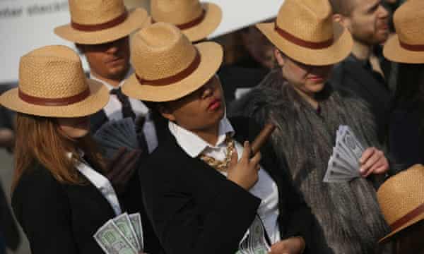 Activists in Berlin wear Panama hats in protest against tax avoidance, after the release of the Panama papers