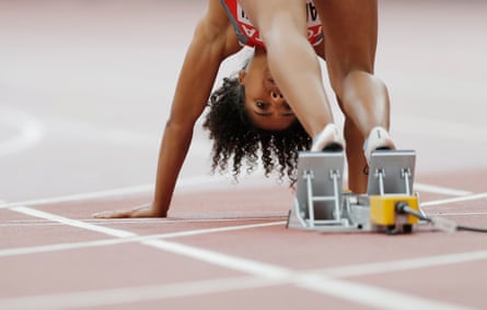 Switzerland’s Mujinga Kambundji puts her feet in the blocks for the start of a women’s 100m heat.