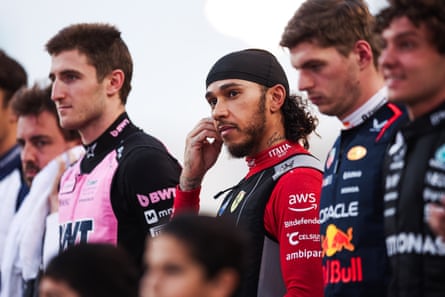 Lewis Hamilton lines up alongside his fellow drivers