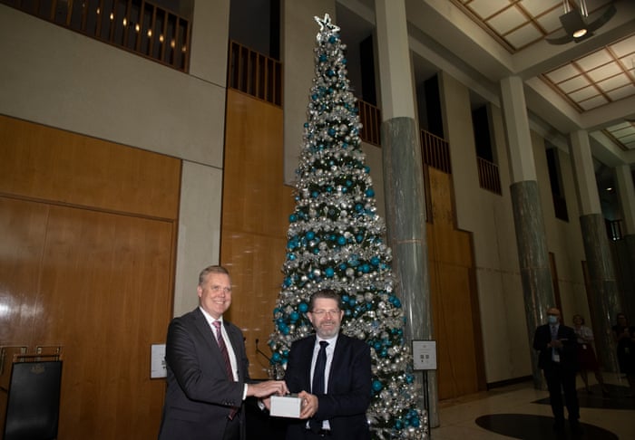 The presiding officers Speaker Tony Smith and President of the Senate Scott Ryan press the button to light the giving tree in the marble foyer of Parliament House.