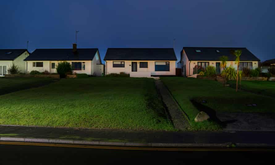 Houses out of season are dark and quiet.