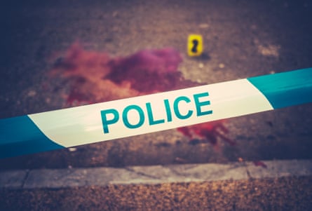 Police tape marks the boundary of a crime scene.