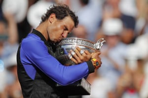 Rafael Nadal kisses the trophy as he celebrates winning his tenth French Open title.