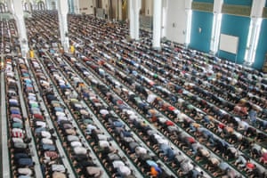 Muslims perform the first Friday prayers at al-Akbar mosque in Surabaya, Indonesia