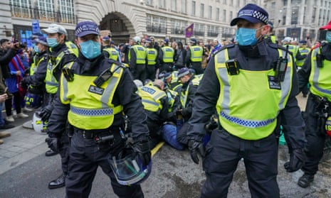  Police officers arresting anti-lockdown protesters in central London, 28 November 2020.
