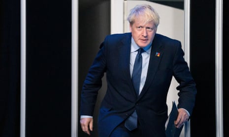 Boris Johnson arrives for a news conference during the Nato summit in Madrid