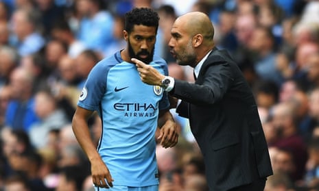 Gaël Clichy takes instructions from Manchester City manager Pep Guardiola in 2016.