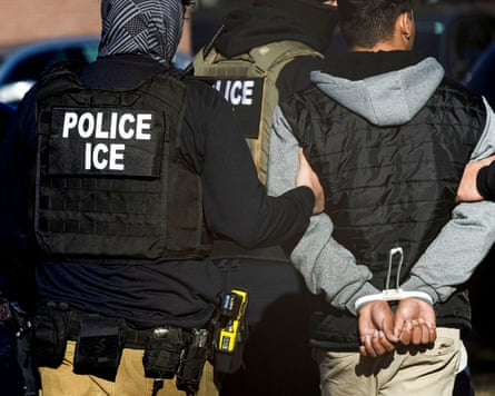 Person handcuffed after ICE raid in Denver
