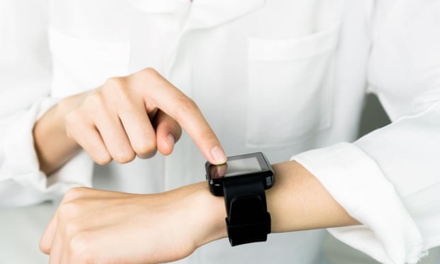 Midsection Of Woman Wearing Smart Watch