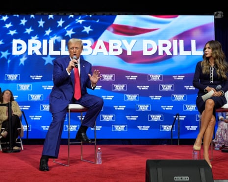 Donald Trump speaks on the campaign trail in Oaks, Pennsylvania, on 14 October 2024, as Kristi Noem listens.