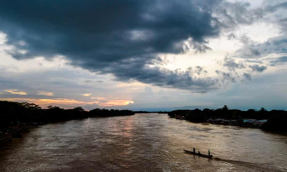 The Arauca River on the border with Venezuela. ‘The guerrillas control everything – they are a fact of life,’ said one Venezuelan migrant labourer.
