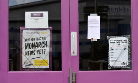 A notice for Monarch staff stuck to a door at Luton airport after the airline ceased trading