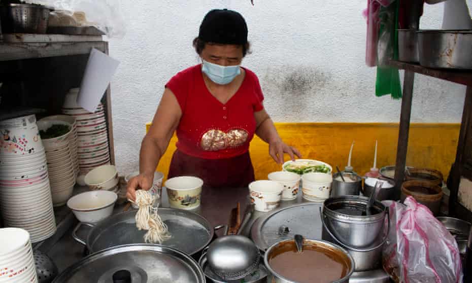 Taiwanese woman Mama Lai at her noodle stall in Taipei, where prices are rising in line with costs in many Asian countries.