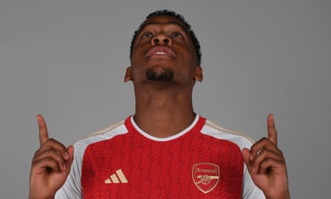 Jurriën Timber in an Arsenal shirt after signing for the club from Ajax on a five-year deal.